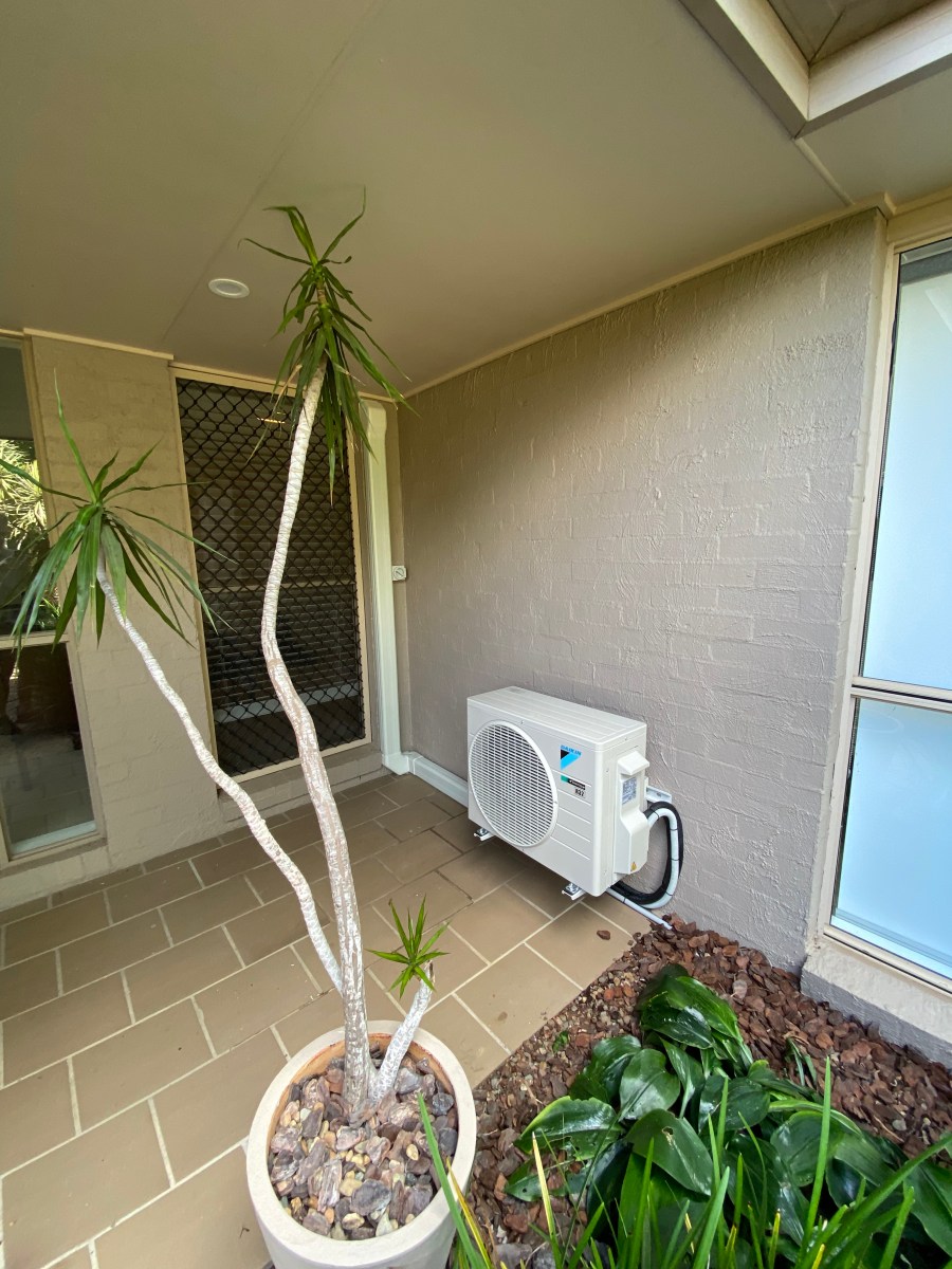 Split system air conditioner installed on wall