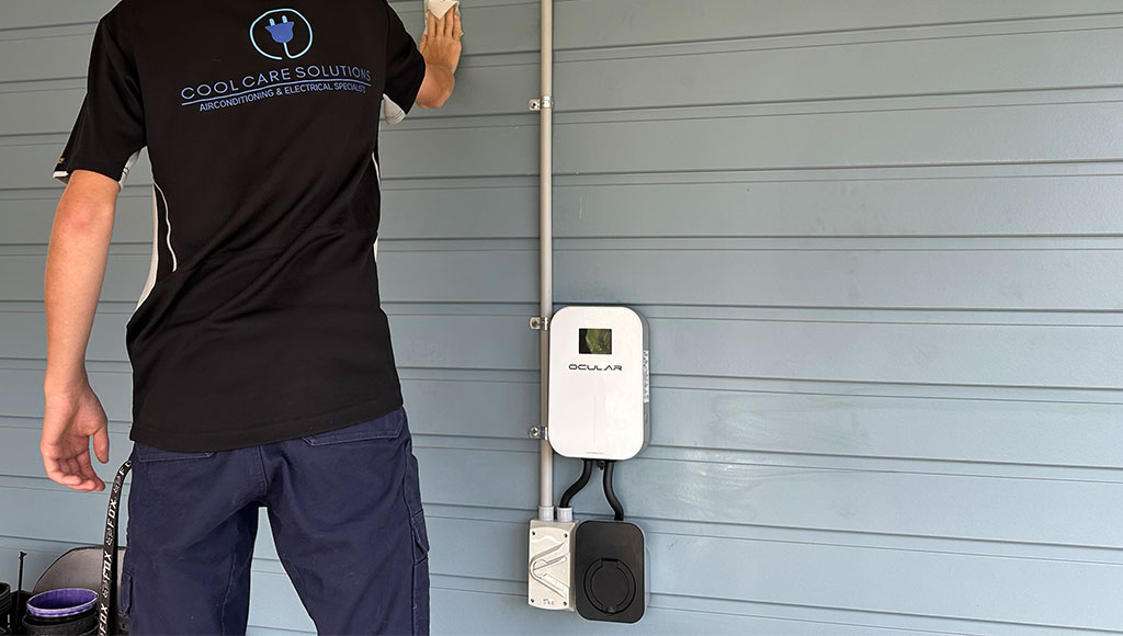 Home EV charger installed on garage wall